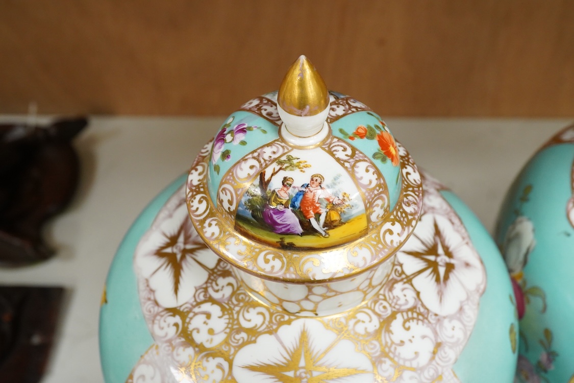 A pair of late 19th century Dresden vases and covers decorated by Helena Wolfsohn, one with damage, 34cm high